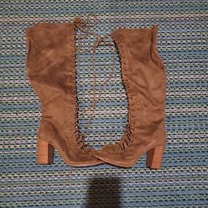 Thigh high lace up heeled booties